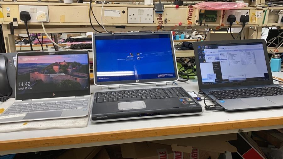 Repaired Windows laptops running tests on the bench